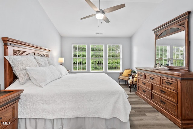 611 Quartz Dr, Durham, NC 27703 - bedroom featuring vaulted ceiling, light wood-type flooring, and ceiling fan