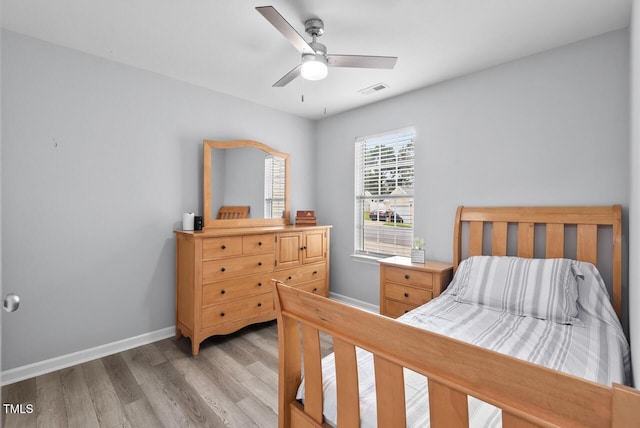 611 Quartz Dr, Durham, NC 27703 - bedroom with light wood-style flooring and a ceiling fan