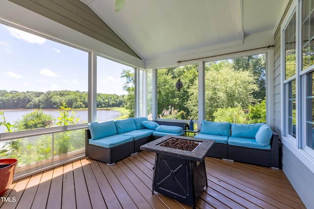 9701 Corktree Ct, Wake Forest, NC 27587 - sunroom featuring an outdoor living space with a fire pit, a water view, vaulted ceiling, and view of scattered trees
