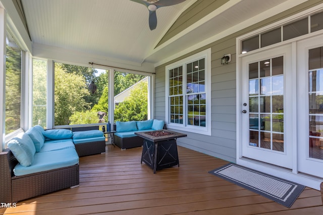 9701 Corktree Ct, Wake Forest, NC 27587 - sunroom featuring vaulted ceiling, ceiling fan, and an outdoor living space with a fire pit