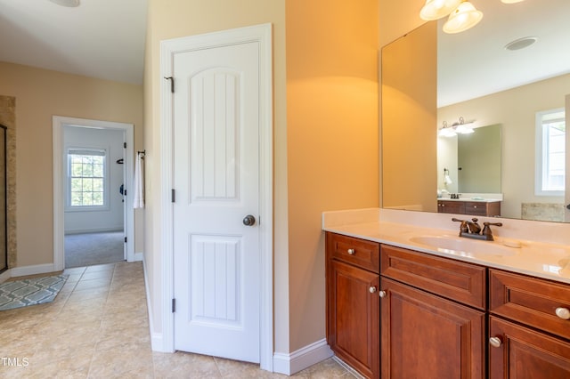 9701 Corktree Ct, Wake Forest, NC 27587 - bathroom with vanity, tile patterned floors, and a shower with shower door
