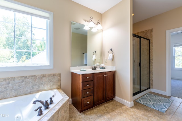 9701 Corktree Ct, Wake Forest, NC 27587 - full bathroom with vanity, a tub with jets, a shower stall, and tile patterned floors