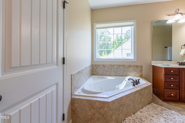 9701 Corktree Ct, Wake Forest, NC 27587 - bathroom with vanity, a jetted tub, and tile patterned floors