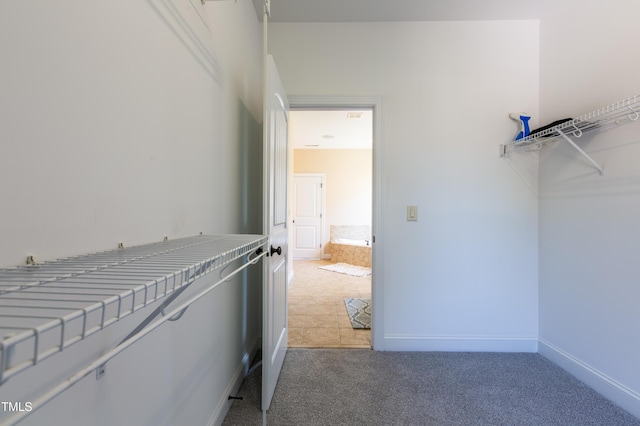 9701 Corktree Ct, Wake Forest, NC 27587 - walk in closet featuring light carpet