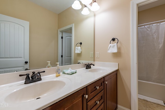 9701 Corktree Ct, Wake Forest, NC 27587 - full bath with double vanity, a chandelier, tile patterned flooring, and shower / bath combo with shower curtain
