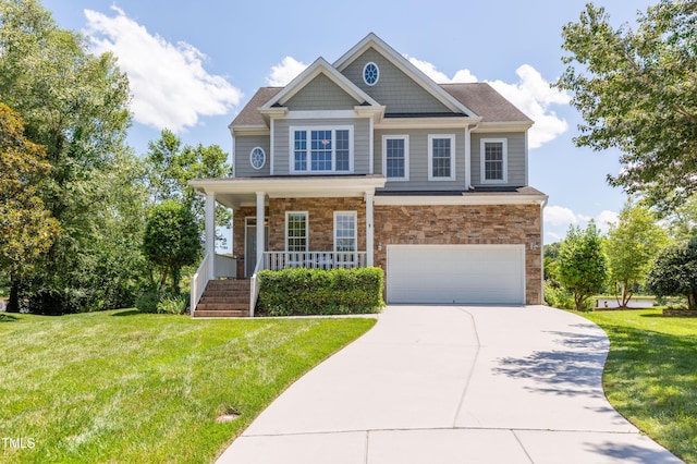 9701 Corktree Ct, Wake Forest, NC 27587 - craftsman house with a garage, covered porch, driveway, a front yard, and stone siding