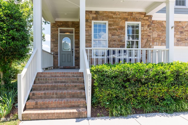 9701 Corktree Ct, Wake Forest, NC 27587 - entrance to property featuring a porch and stone siding