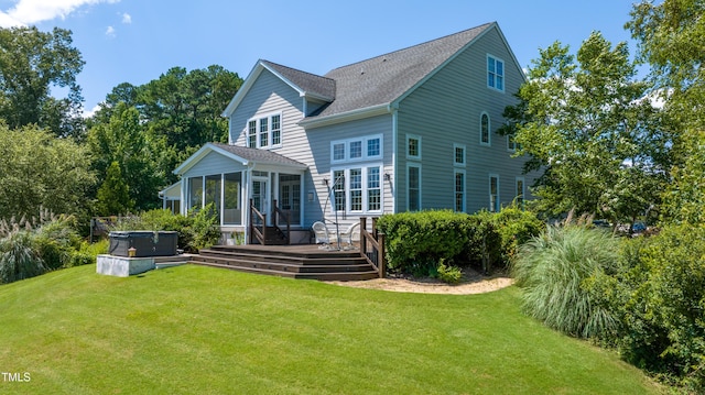 9701 Corktree Ct, Wake Forest, NC 27587 - back of house with a hot tub, a sunroom, a deck, and a yard