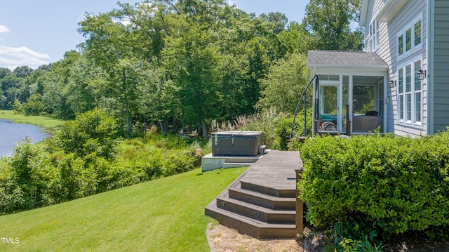 9701 Corktree Ct, Wake Forest, NC 27587 - view of grassy yard with a hot tub, a deck, and a sunroom