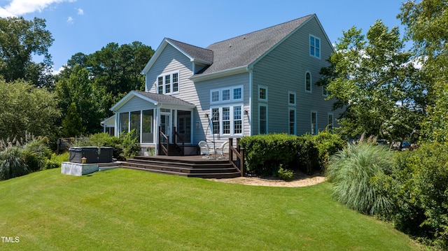 9701 Corktree Ct, Wake Forest, NC 27587 - rear view of property featuring a hot tub, a sunroom, a deck, and a lawn