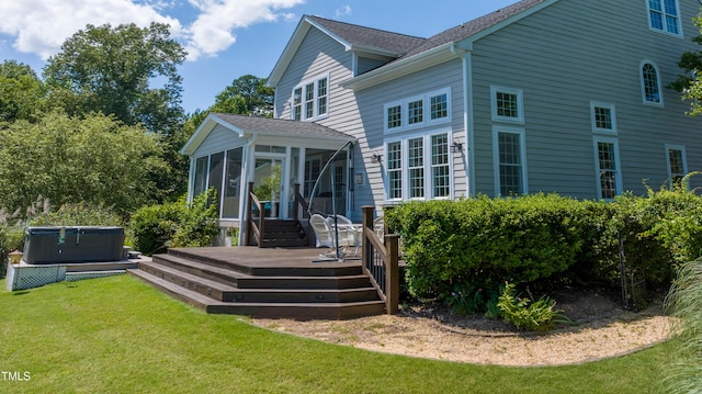 9701 Corktree Ct, Wake Forest, NC 27587 - rear view of house with a hot tub, a sunroom, a deck, a lawn, and a shingled roof