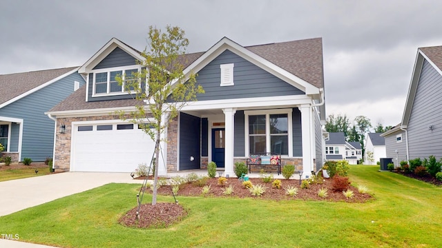 1720 Pinecliff Ct, Fuquay Varina, NC 27526 - craftsman inspired home featuring covered porch, stone siding, a front lawn, and driveway