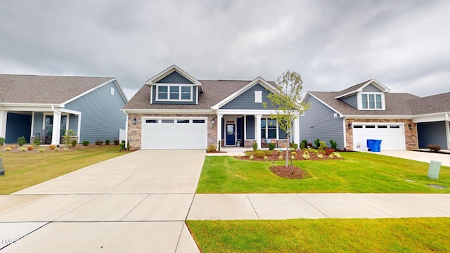 1720 Pinecliff Ct, Fuquay Varina, NC 27526 - craftsman-style house featuring a porch, stone siding, driveway, and a front yard