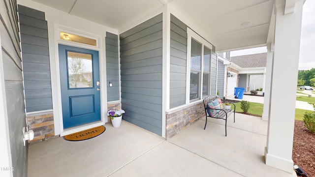 1720 Pinecliff Ct, Fuquay Varina, NC 27526 - view of exterior entry featuring covered porch and stone siding