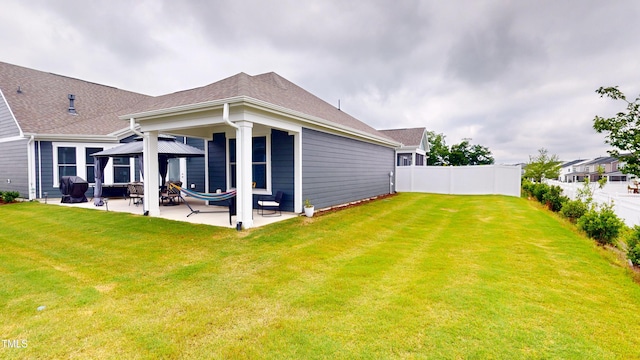 1720 Pinecliff Ct, Fuquay Varina, NC 27526 - back of house with a patio area, a gazebo, and roof with shingles
