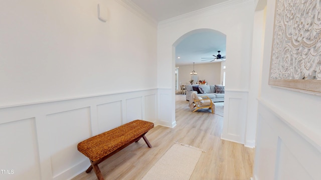 1720 Pinecliff Ct, Fuquay Varina, NC 27526 - hall with arched walkways, light wood-type flooring, a wainscoted wall, ornamental molding, and a decorative wall