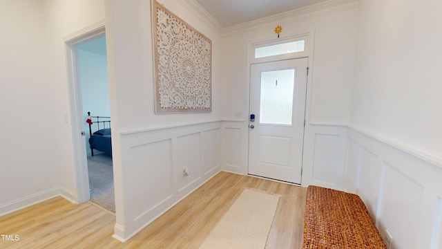 1720 Pinecliff Ct, Fuquay Varina, NC 27526 - entryway featuring a decorative wall, light wood-style flooring, plenty of natural light, a wainscoted wall, and ornamental molding