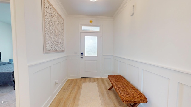 1720 Pinecliff Ct, Fuquay Varina, NC 27526 - entryway with light wood-style floors, a wainscoted wall, a decorative wall, and ornamental molding