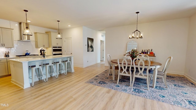 1720 Pinecliff Ct, Fuquay Varina, NC 27526 - dining space featuring light wood-style floors, a chandelier, and recessed lighting