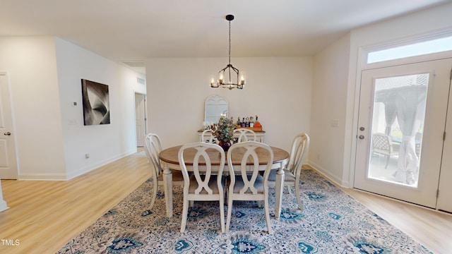 1720 Pinecliff Ct, Fuquay Varina, NC 27526 - dining space with light wood-style floors and a chandelier