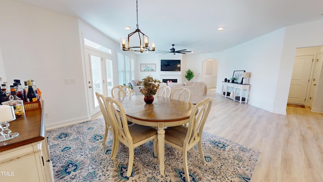 1720 Pinecliff Ct, Fuquay Varina, NC 27526 - dining room featuring arched walkways, light wood-type flooring, a chandelier, and recessed lighting