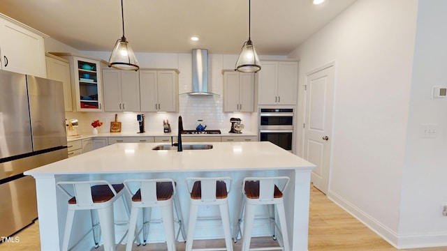 1720 Pinecliff Ct, Fuquay Varina, NC 27526 - kitchen with wall chimney range hood, stainless steel appliances, a kitchen breakfast bar, tasteful backsplash, and recessed lighting
