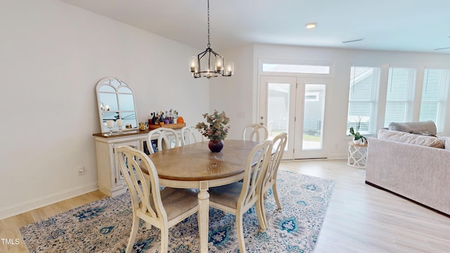 1720 Pinecliff Ct, Fuquay Varina, NC 27526 - dining space featuring a chandelier and light wood-style floors