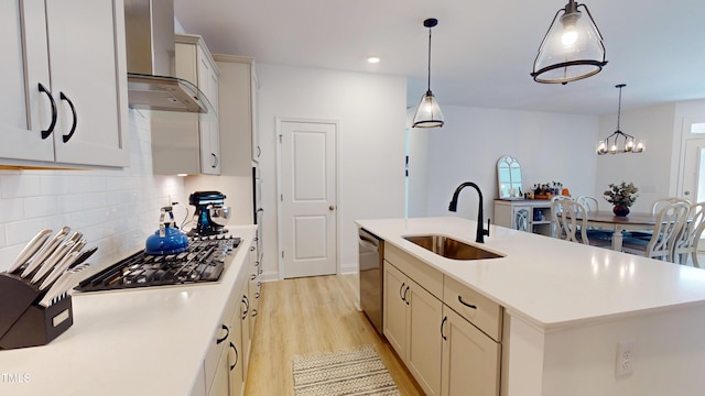 1720 Pinecliff Ct, Fuquay Varina, NC 27526 - kitchen with wall chimney range hood, appliances with stainless steel finishes, light wood-type flooring, decorative backsplash, and light countertops