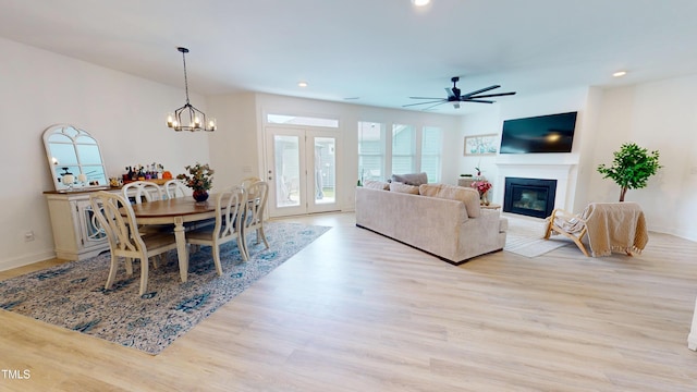 1720 Pinecliff Ct, Fuquay Varina, NC 27526 - living area featuring a glass covered fireplace, a ceiling fan, wood finished floors, recessed lighting, and a chandelier