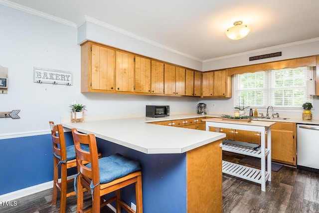 2120 Northcrest Dr, Elon, NC 27244 - kitchen with stainless steel dishwasher, ornamental molding, light countertops, and dark wood-style floors