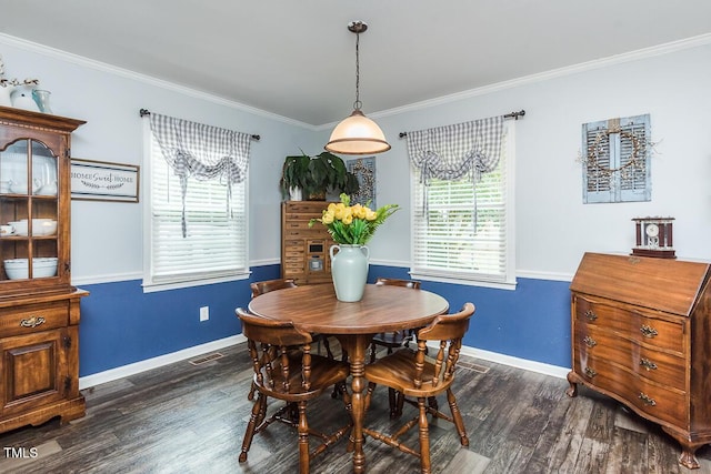 2120 Northcrest Dr, Elon, NC 27244 - dining space featuring dark wood-style flooring, healthy amount of natural light, and crown molding