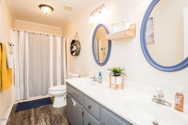 2120 Northcrest Dr, Elon, NC 27244 - bathroom with crown molding, double vanity, and wood finished floors