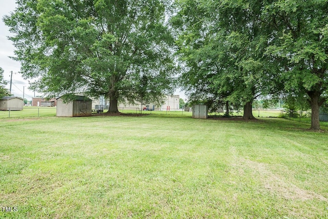 2120 Northcrest Dr, Elon, NC 27244 - fenced backyard featuring a storage unit