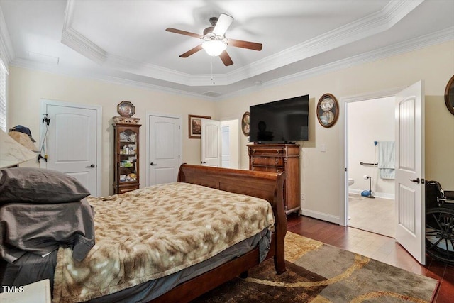 23 Northern Way Ct, Durham, NC 27712 - bedroom with a tray ceiling, crown molding, wood finished floors, ceiling fan, and connected bathroom