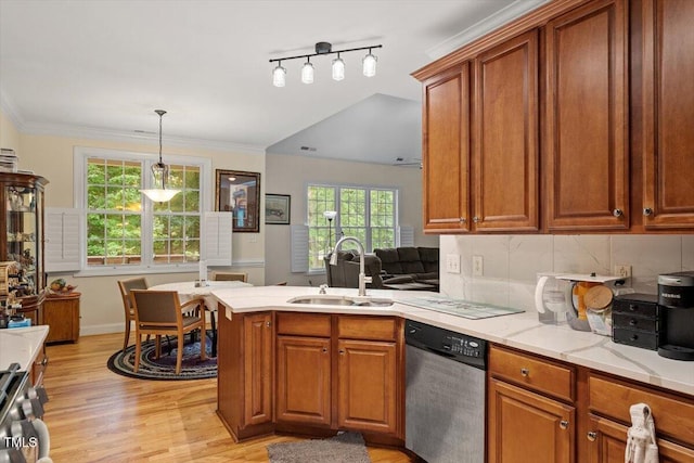 23 Northern Way Ct, Durham, NC 27712 - kitchen with stainless steel dishwasher, a peninsula, light wood-type flooring, plenty of natural light, and crown molding
