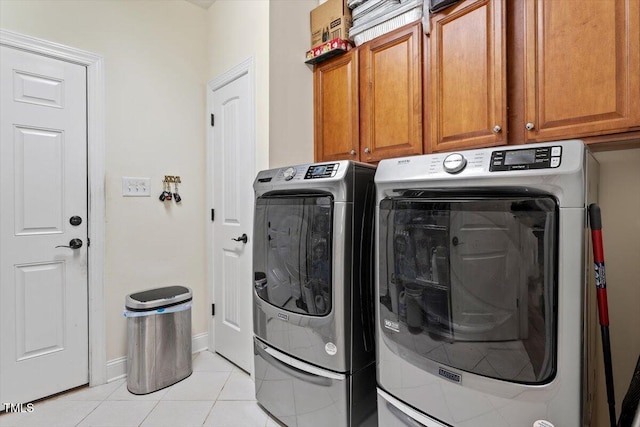 23 Northern Way Ct, Durham, NC 27712 - laundry area with washer and clothes dryer, cabinet space, and light tile patterned flooring