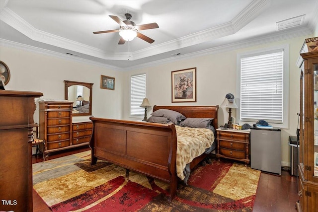 23 Northern Way Ct, Durham, NC 27712 - bedroom featuring wood-type flooring, a tray ceiling, multiple windows, crown molding, and ceiling fan