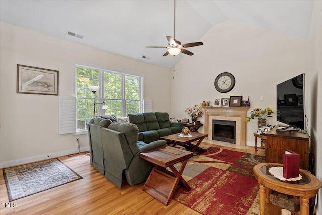 23 Northern Way Ct, Durham, NC 27712 - living room with light wood-type flooring, a ceiling fan, a fireplace with flush hearth, and high vaulted ceiling