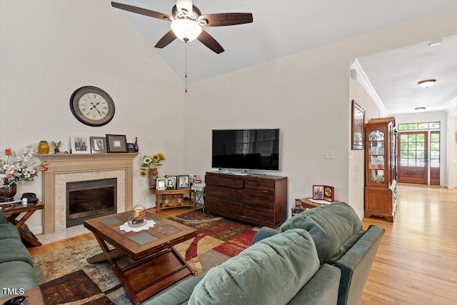 23 Northern Way Ct, Durham, NC 27712 - living room featuring light wood-style floors, ceiling fan, a high end fireplace, lofted ceiling, and crown molding