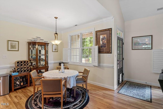 23 Northern Way Ct, Durham, NC 27712 - dining space with light wood-style flooring and crown molding