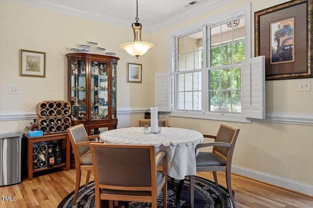 23 Northern Way Ct, Durham, NC 27712 - dining area featuring light wood-style flooring and ornamental molding
