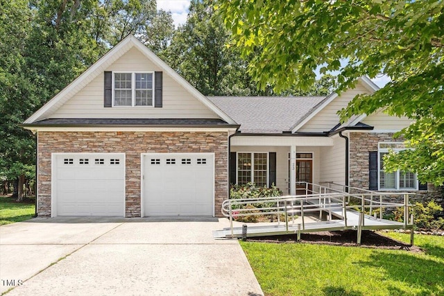 23 Northern Way Ct, Durham, NC 27712 - view of front facade featuring stone siding, driveway, covered porch, and a front lawn