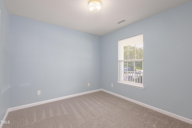 418 Lodestone Dr, Durham, NC 27703 - carpeted empty room featuring baseboards