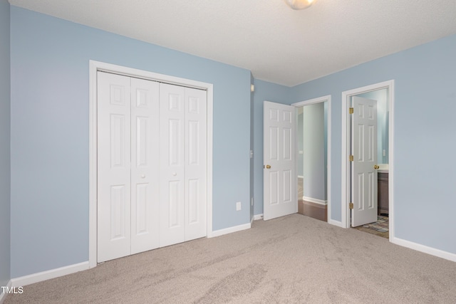 418 Lodestone Dr, Durham, NC 27703 - unfurnished bedroom with carpet floors, a closet, and ensuite bath