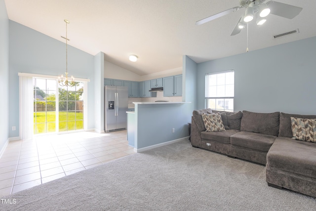 418 Lodestone Dr, Durham, NC 27703 - living room with a chandelier, lofted ceiling, ceiling fan, light carpet, and light tile patterned flooring