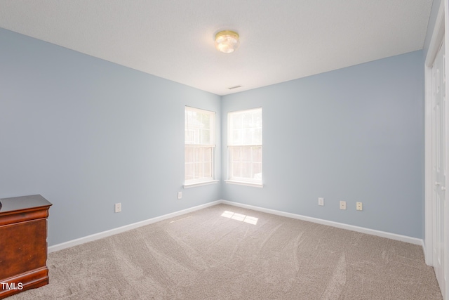 418 Lodestone Dr, Durham, NC 27703 - empty room with carpet floors and baseboards