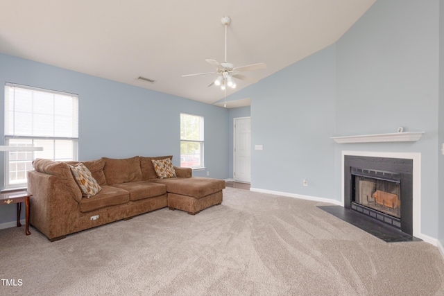 418 Lodestone Dr, Durham, NC 27703 - carpeted living room featuring ceiling fan, vaulted ceiling, and a fireplace with flush hearth