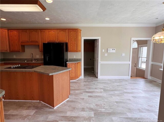 333 Westwater Way, Fayetteville, NC 28301 - kitchen featuring black appliances, crown molding, brown cabinets, a textured ceiling, and hanging light fixtures