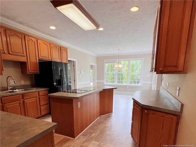 333 Westwater Way, Fayetteville, NC 28301 - kitchen with black appliances, ornamental molding, a kitchen island, a textured ceiling, and brown cabinetry