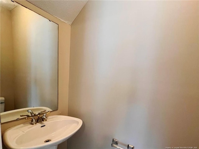 333 Westwater Way, Fayetteville, NC 28301 - bathroom with a sink and a textured ceiling